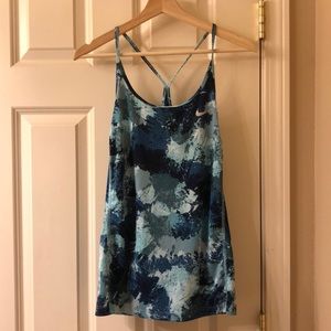 Blue Nike tank top.